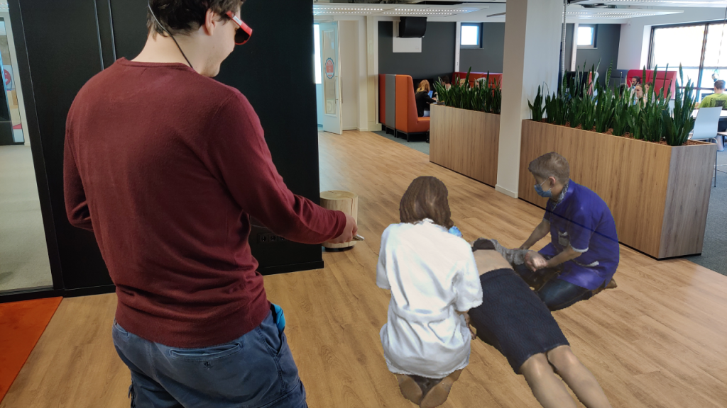 A user looks at a 3D model placed at a specific location in their physical space.